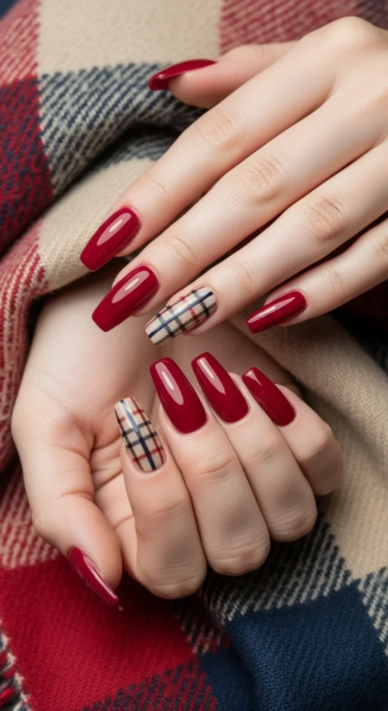 Crimson coffin nails with plaid accent laid over checkered scarf.