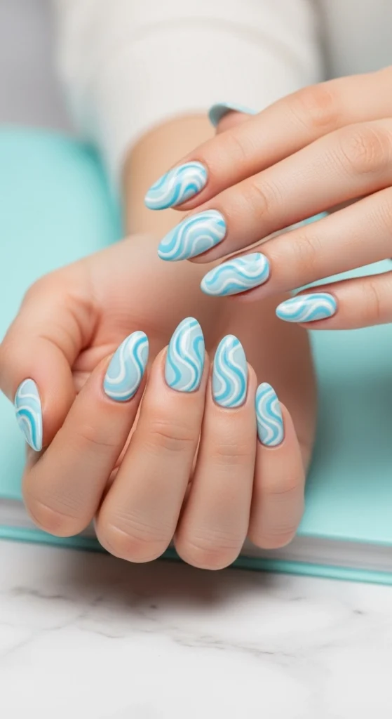 15 Must Try Trendy Back to School Nail Ideas 2026 8 baby-blue-and-white-swirls