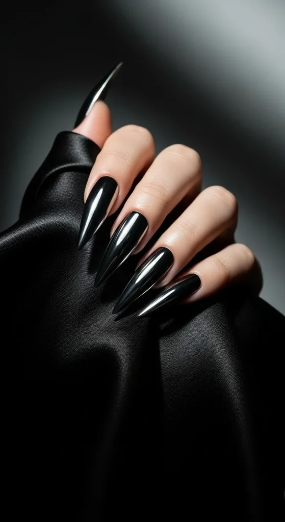 How to Shape Your Nails Like a Pro (Round, Almond, Coffin & More) 8 High-drama beauty shot of stiletto nails painted in metallic chrome. Long, sharply pointed tips catching studio light.