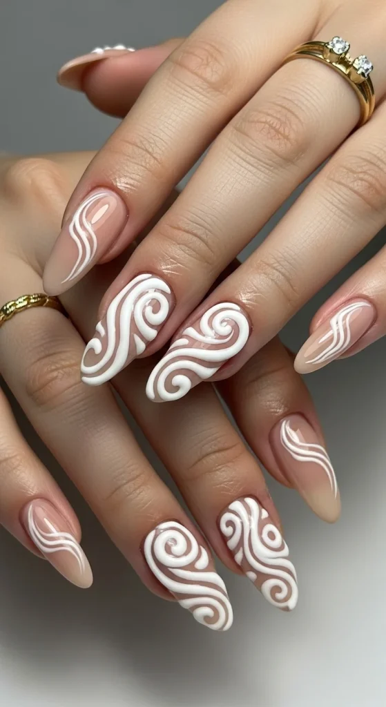 White 3D swirl nail art on glossy nude almond nails, bold minimal Pinterest nail design 2026.