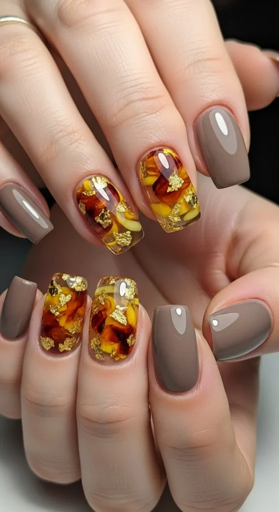 Taupe nails with amber gemstone effect accent nails with golden flecks