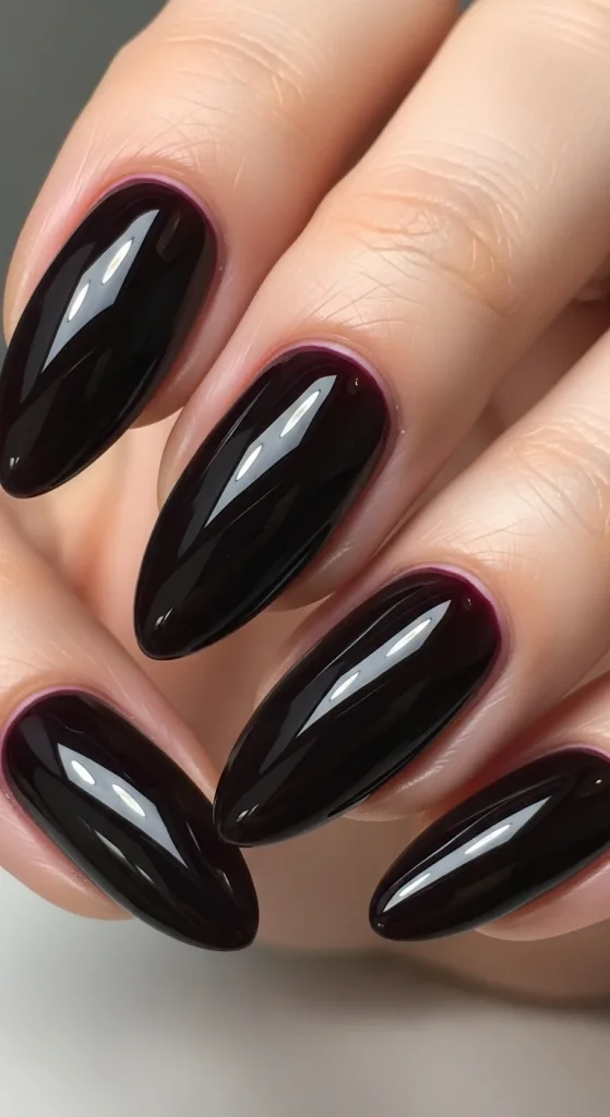 Black cherry glazed nails, glossy fall 2025 manicure.