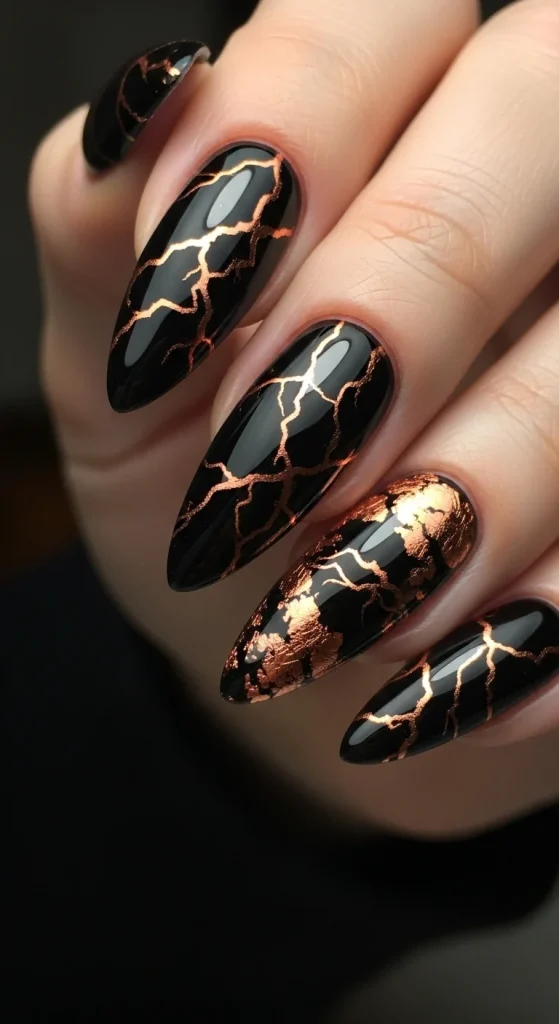 Black Fall Nails 2026: 19 Trendy Designs You’ll Love 20 Black almond nails with copper foil veins.