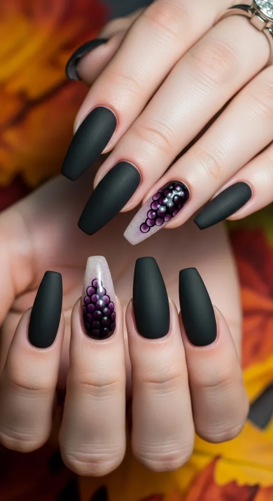 Stiletto nails in matte blackberry polish.

