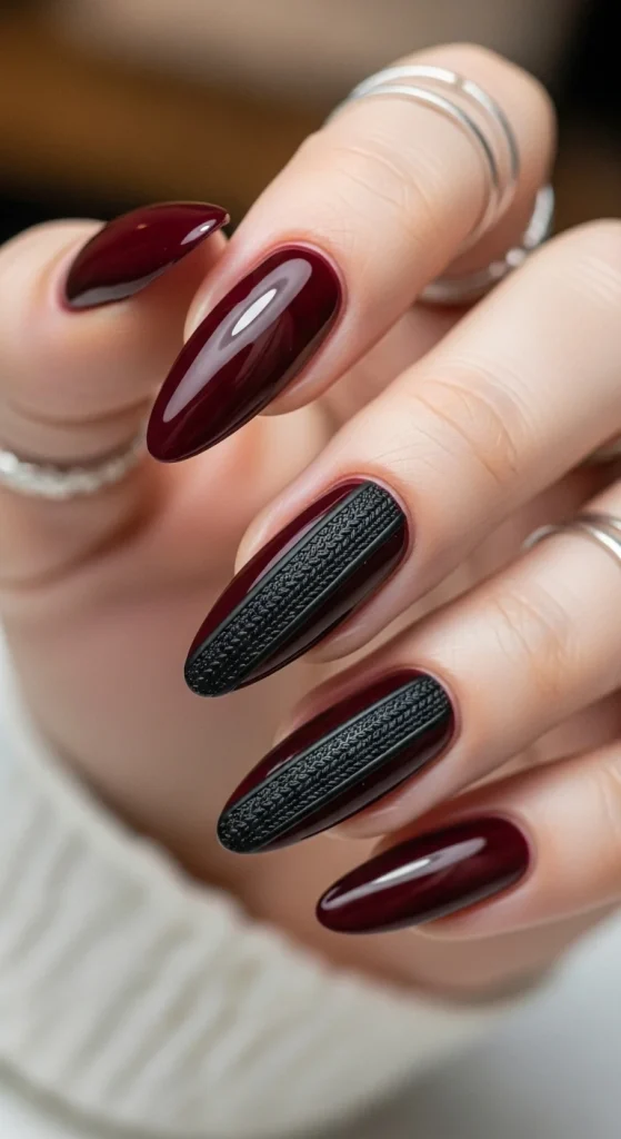 Glossy burgundy nails with matte stripe knit-like textures