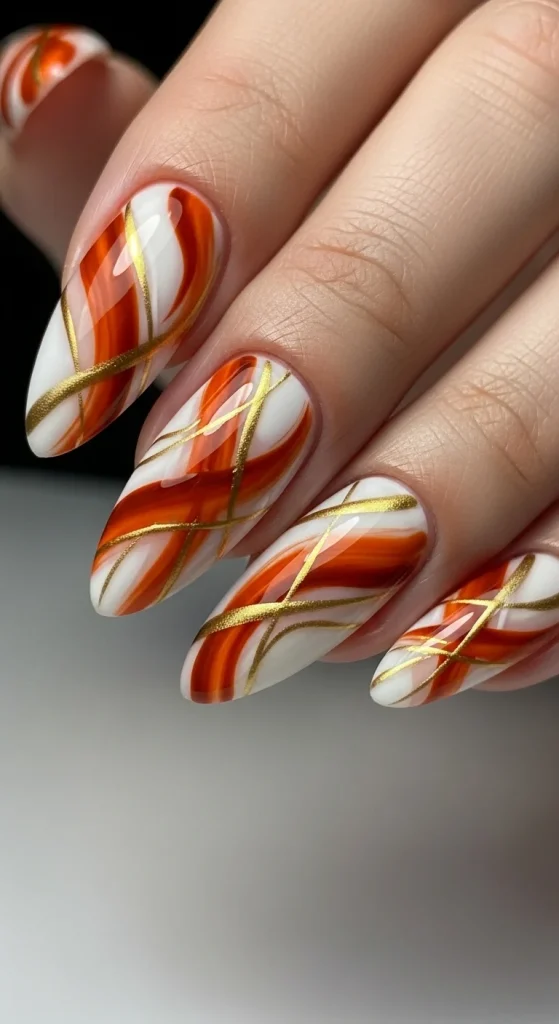 Warm Fall Nail Designs 2026: Earth Tone Manicure Ideas You’ll Love 6 Burnt orange and gold abstract nail art