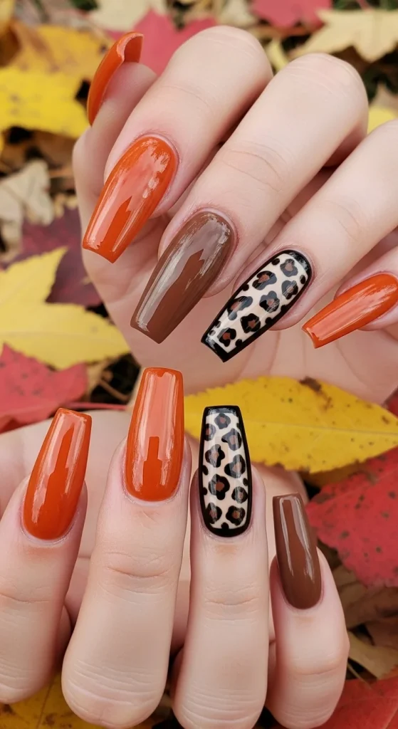  Burnt orange safari nails with leopard prints for fall 2025.