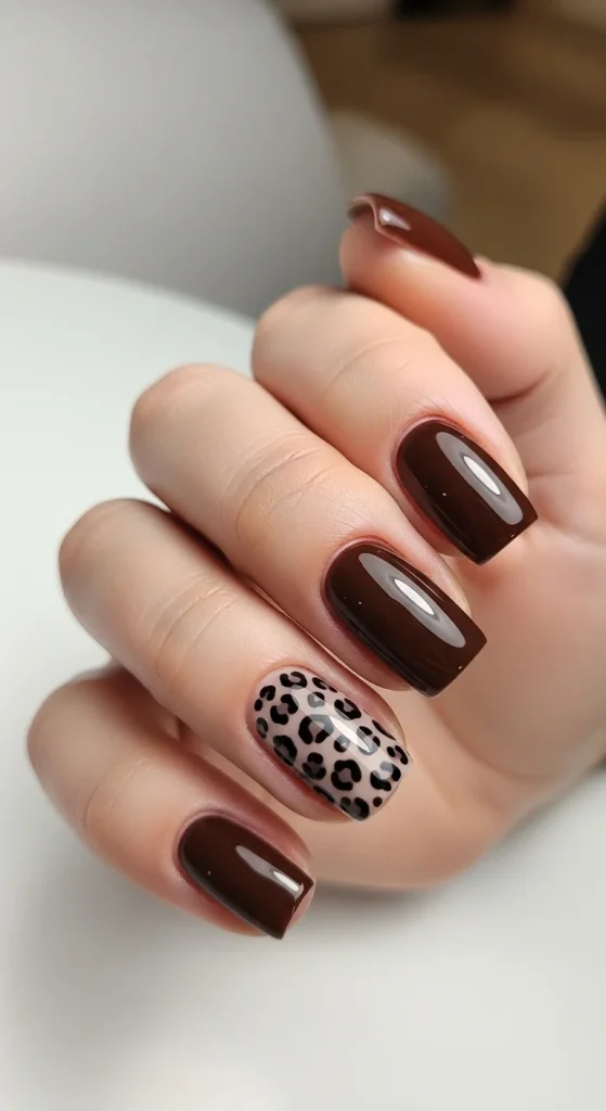  Espresso leopard short nails with subtle animal print accents.