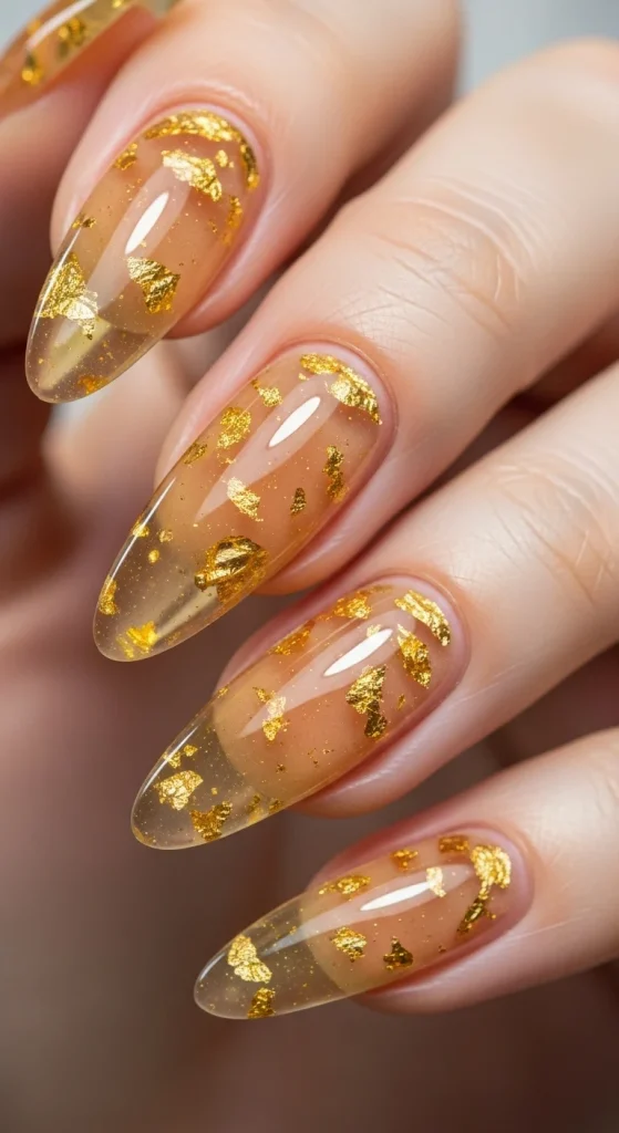 20 Chic September Nail Designs for 2026 That Capture Fall’s First Glow 10 Amber jelly nails with gold flakes.