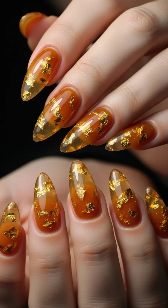 Glossy caramel jelly nails with golden foil flakes glowing inside