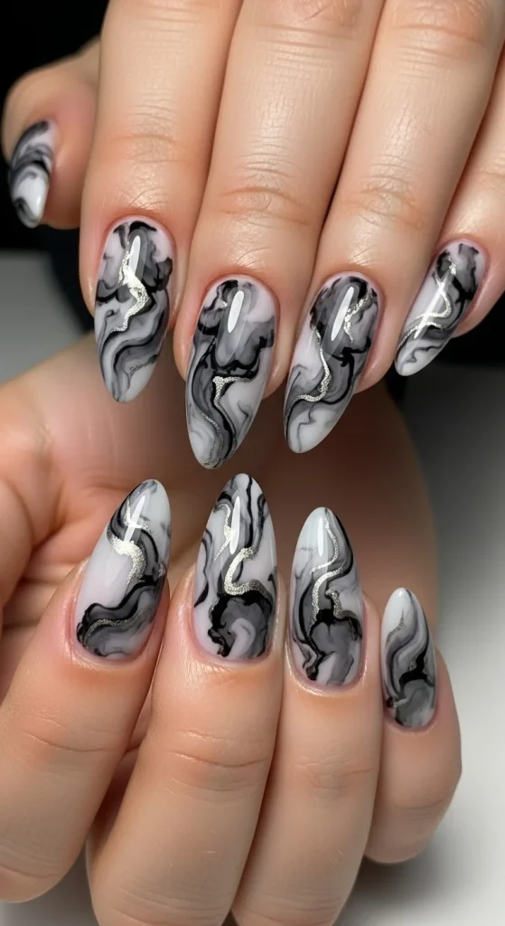 Almond nails with black and grey marble ink effect.