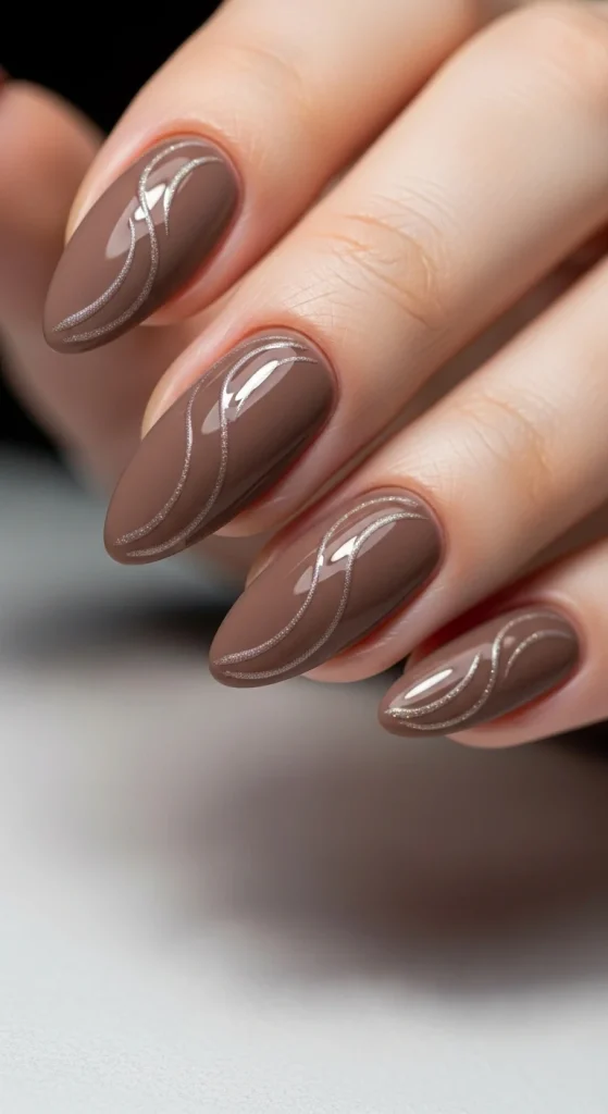 Mocha matte nails with glossy swirl accents