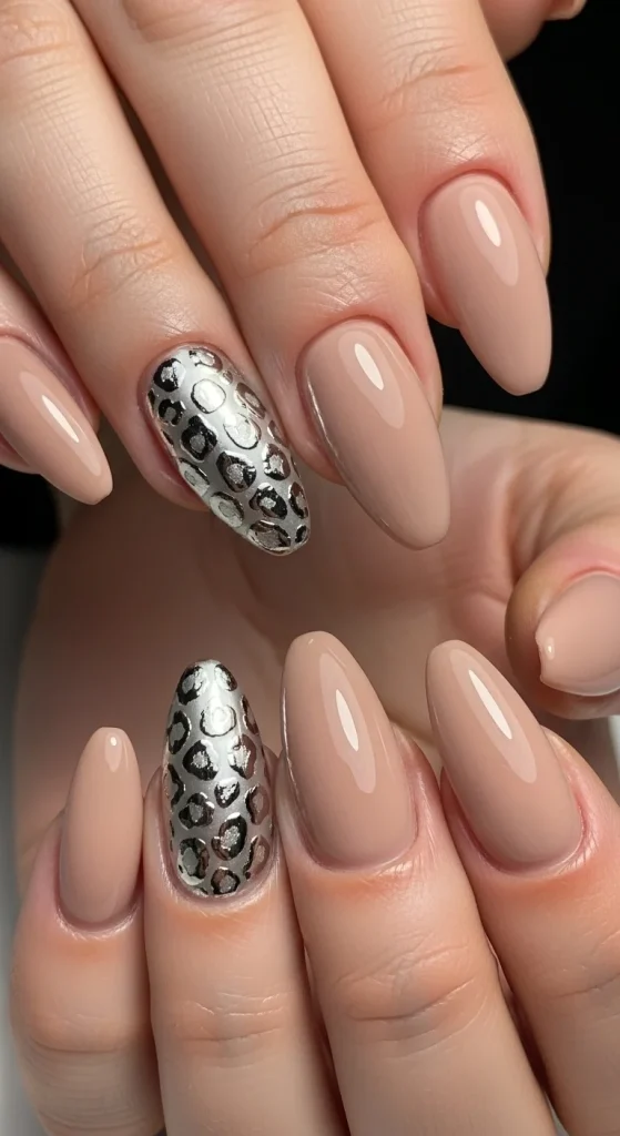 Nude nails with silver chrome leopard accents for Fall 2025.