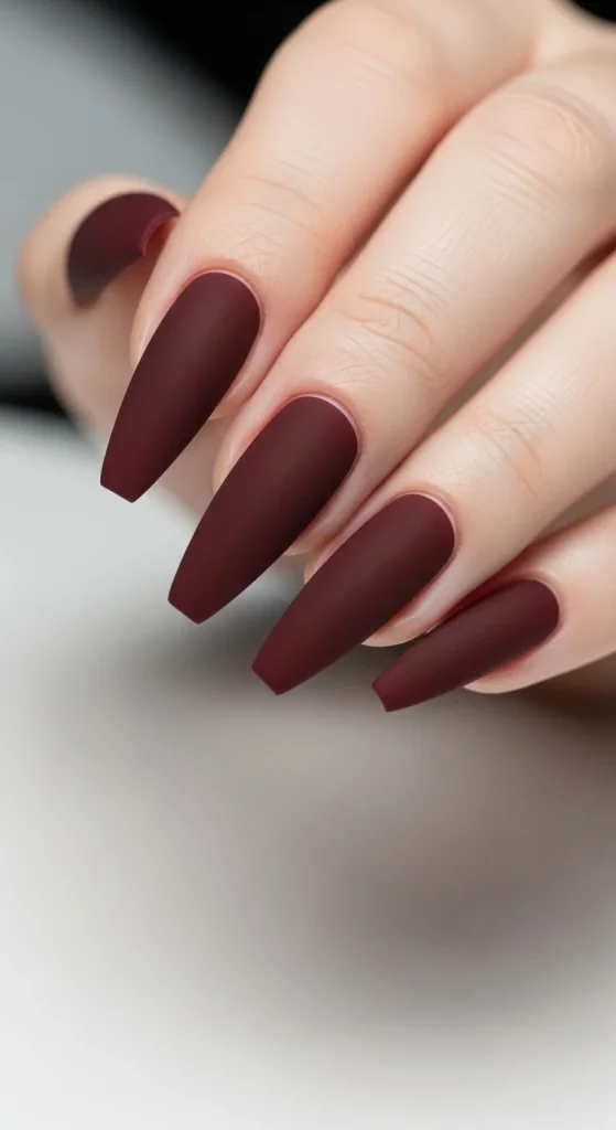 Oxblood matte coffin nails, dramatic fall 2025 design