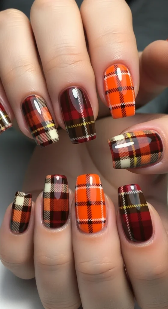 Pumpkin plaid nail design with cozy autumn vibe.