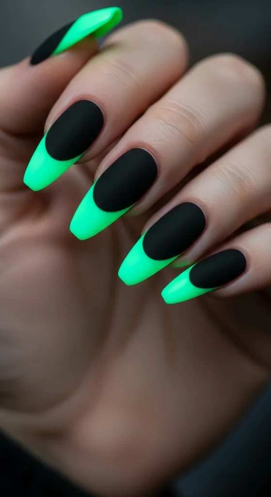 Halloween black nails with neon green glowing French tips