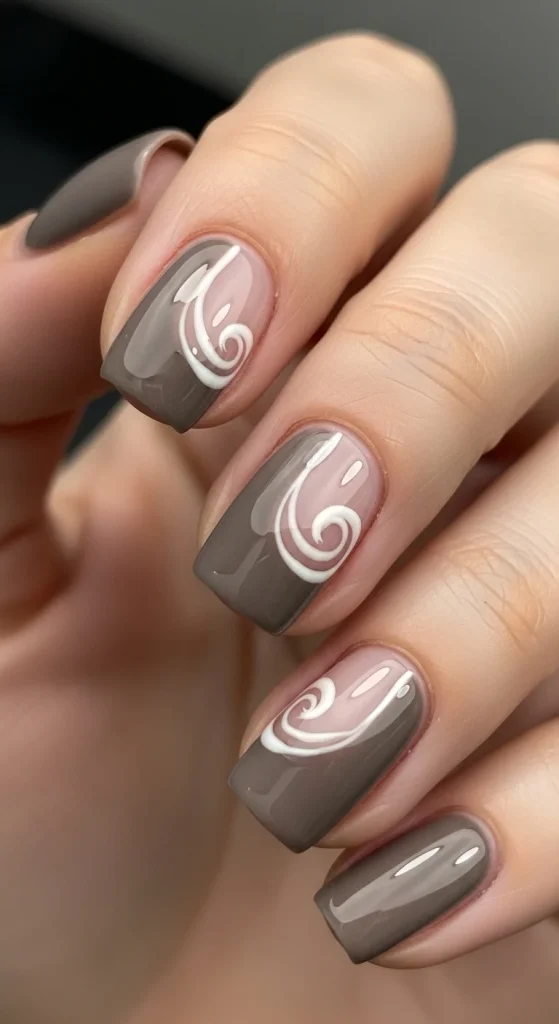 Taupe swirl negative space nails, minimalist fall trend 2025.