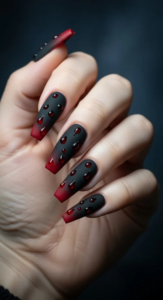 Vampire aura reverse gradient nails — black to red fade with droplets.