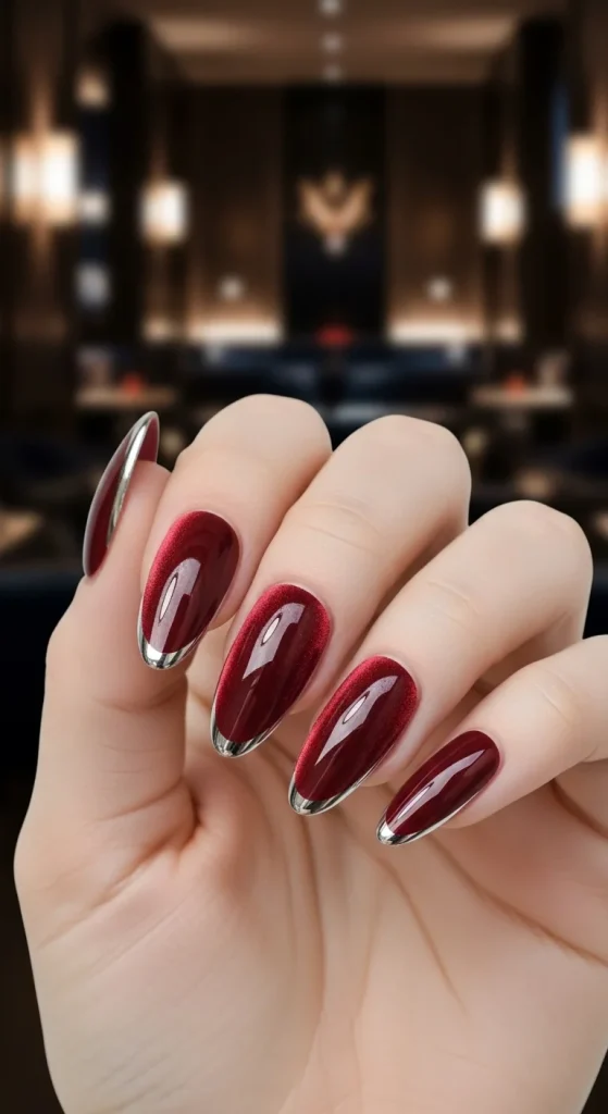 Wine red chrome velvet almond nails, fall manicure 2025.