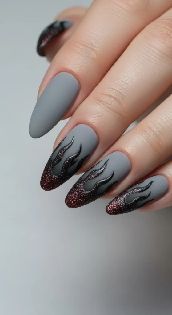 Burnt Ash Tips Halloween nails with gray and black flame edges.