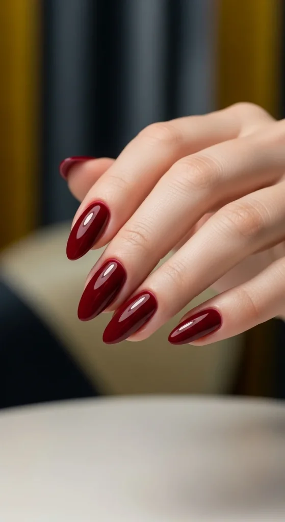 Deep cabernet wine gel nails with glossy finish for fall evenings.
