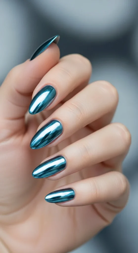 Silver-blue chrome gradient nails for bold winter 2025 look.