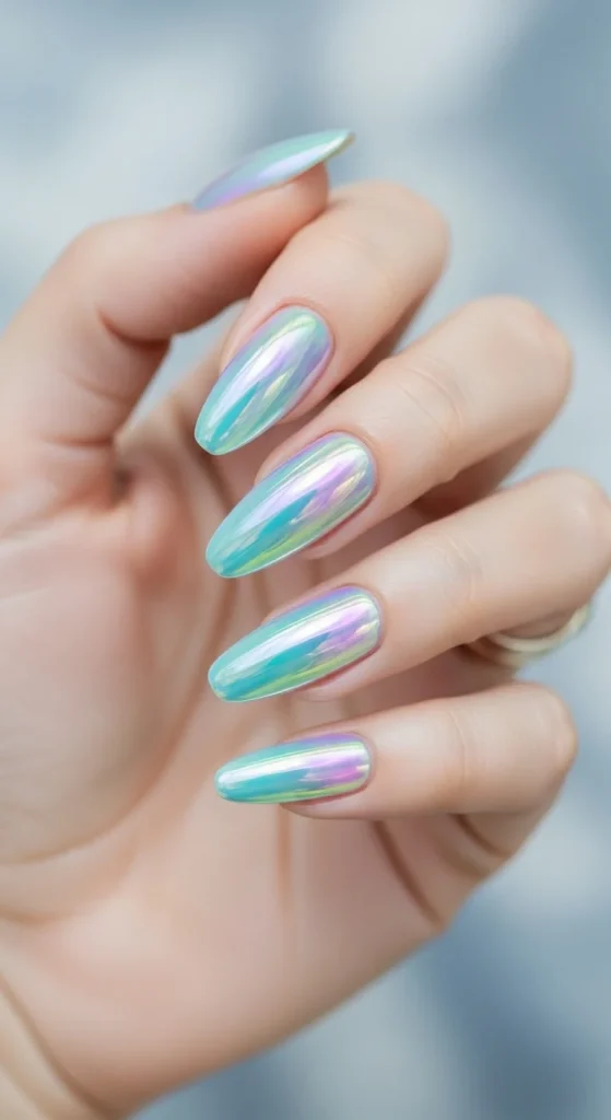 Icy aurora nails with shifting chrome hues inspired by northern lights.