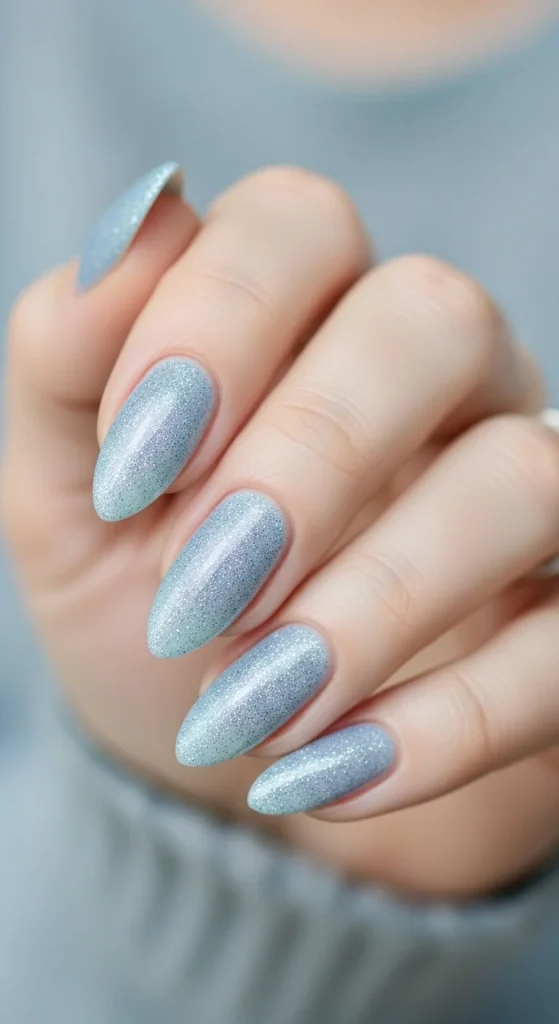 icy blue glitter nails with shimmer and frosty tone