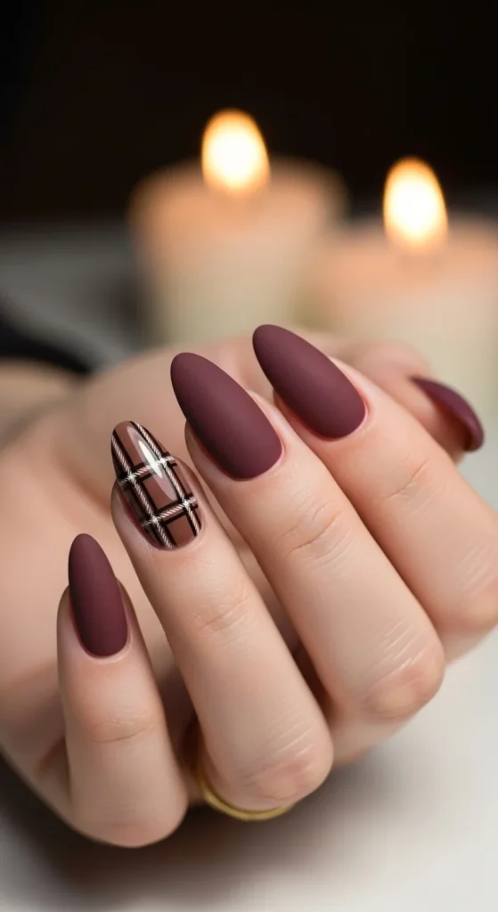 Plaid Nails with Cozy Sweater Texture: Holiday Nail Designs 2025 5 Matte burgundy nails with mocha plaid accent nail.