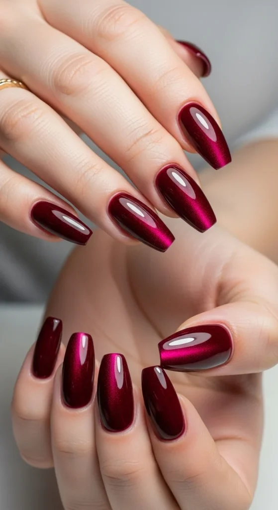 15 Red Nail Designs 2026: Cherry, Dark & Trendy Ideas You’ll Love 8 Almond-shaped nails featuring a dark cherry red base with a brighter red blended into the center for a vibrant two-tone gradient look.