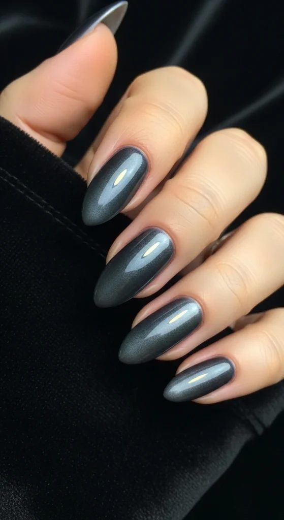 Gunmetal ombré nails for a modern New Year’s Eve look.