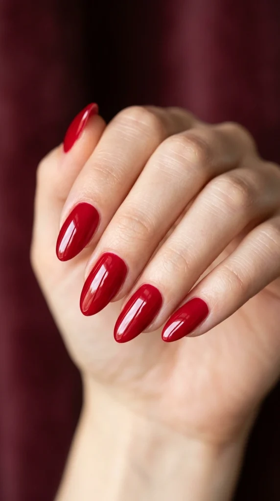 Summer Nail Colors 2026: 25 Trending Shades to Wear This Season 24 Deep cherry red almond nails with a glossy finish, a timeless elegant summer nail color trend for 2026.