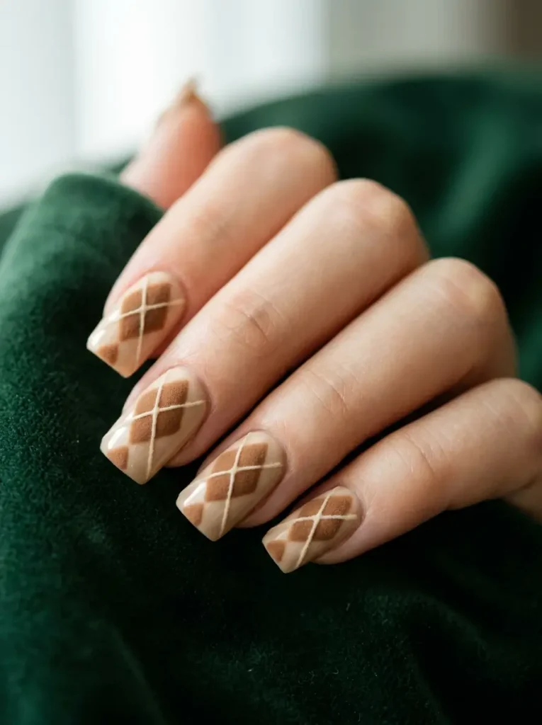 Raised texture argyle nails with toffee brown diamonds and cream crossing lines on a warm oatmeal base