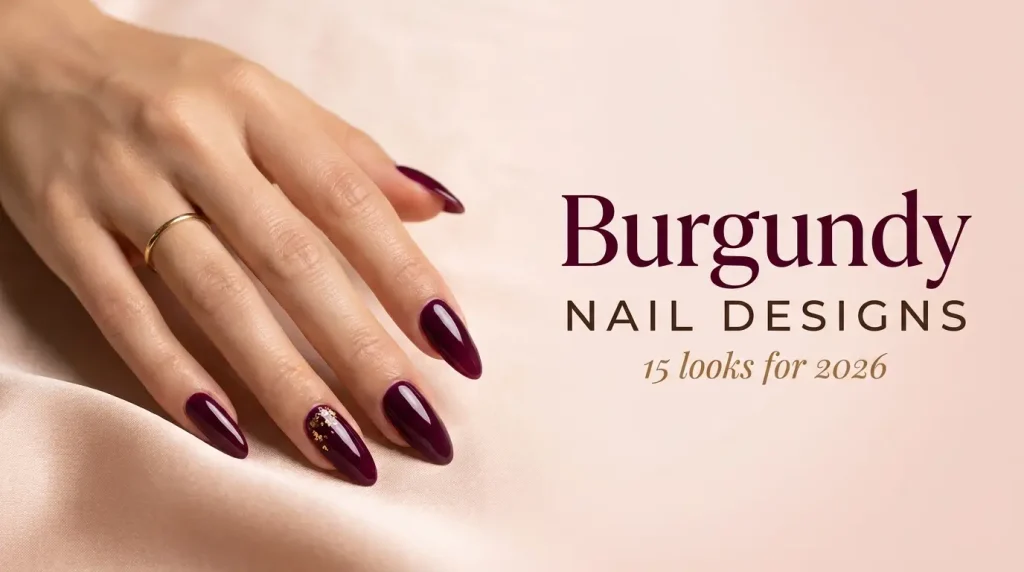 Burgundy nail designs 2026 cover, long almond nails in glossy deep burgundy with gold foil on one nail, medium skin tone