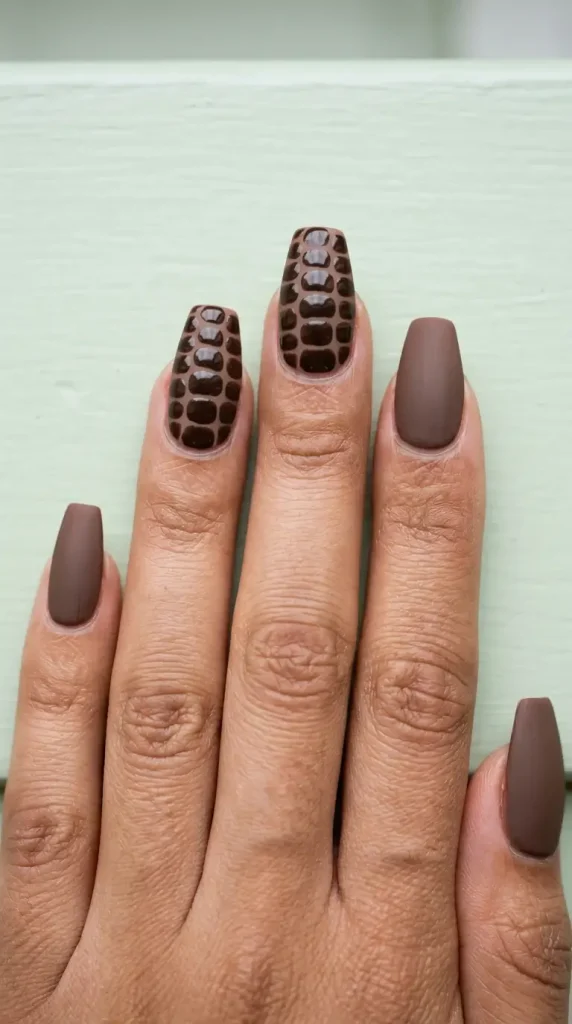 Short coffin mocha croc print nails with glossy scale pattern on two accent nails over matte mocha