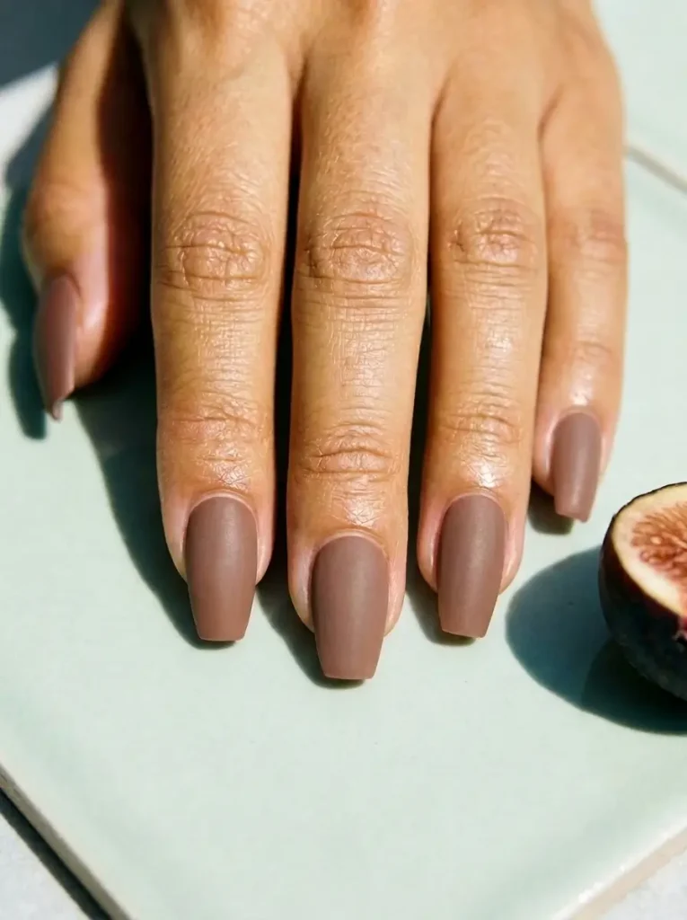 18 Fall Nail Colors for 2026, From Taupe to Navy 5 Mocha brown matte coffin nails of medium length, on a medium skin tone