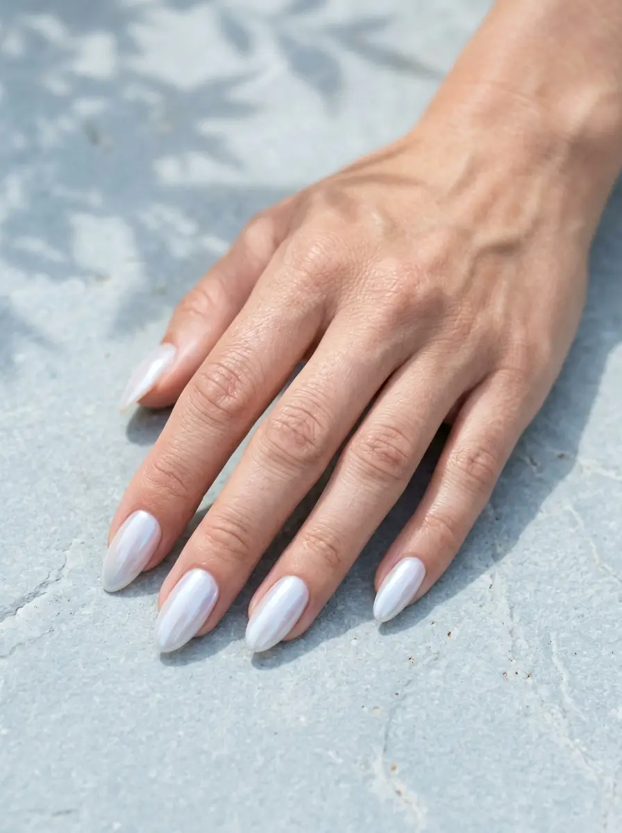 15 Witchy Nail Designs for 2026, From Gothic to Green Witch 15 Almond nails in milky iridescent moonstone jelly with a soft blue flash, on a light skin tone